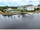 Exterior view of the property with a tranquil pond featuring a water fountain and clubhouse with pool at 3786 Hitchcock Way # 321, Myrtle Beach, SC 29577