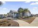 Welcoming clubhouse exterior with covered porch, sidewalk, landscaping and parking at 4027 Taranto Loop # C, Myrtle Beach, SC 29579