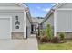 Charming facade with black metal gate and green lawn at 4027 Taranto Loop # C, Myrtle Beach, SC 29579