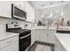 Bright kitchen with modern appliances and white cabinetry at 4027 Taranto Loop # C, Myrtle Beach, SC 29579