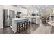 Modern, all-white kitchen featuring stainless steel appliances and a stylish island at 4027 Taranto Loop # C, Myrtle Beach, SC 29579