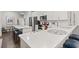 Spacious kitchen with white cabinets, modern appliances, and a breakfast bar at 4027 Taranto Loop # C, Myrtle Beach, SC 29579