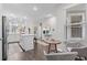 Bright kitchen with white cabinets, a center island, and open access to the living area at 4027 Taranto Loop # C, Myrtle Beach, SC 29579