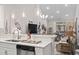 Bright open-concept living and dining area with a kitchen bar, perfect for entertaining guests at 4027 Taranto Loop # C, Myrtle Beach, SC 29579