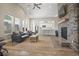 Open-concept living room featuring a stone fireplace, vaulted ceilings, and cozy seating area at 4027 Taranto Loop # C, Myrtle Beach, SC 29579