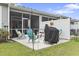 Charming patio with colorful seating, potted plants, barbecue grill, and privacy fence at 4027 Taranto Loop # C, Myrtle Beach, SC 29579