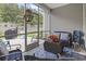 Screened porch with comfortable seating, decorative rug, and cozy furnishings at 4027 Taranto Loop # C, Myrtle Beach, SC 29579