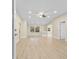 Bright living room featuring modern flooring, fresh paint, and a stylish ceiling fan at 409 14Th Ave. S, North Myrtle Beach, SC 29582