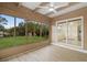 Bright sun room with large windows offering serene views of the backyard at 409 14Th Ave. S, North Myrtle Beach, SC 29582