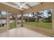 Relaxing sun room with multiple windows providing scenic views of the landscaped backyard at 409 14Th Ave. S, North Myrtle Beach, SC 29582