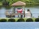 Scenic view of waterfront boat dock and lift, as seen from the pool at 4110 Gray Heron Dr., North Myrtle Beach, SC 29582