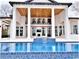 Stunning covered patio with wood ceiling, opening up to a beautiful pool with blue tile at 4110 Gray Heron Dr., North Myrtle Beach, SC 29582