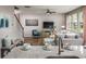 Open-concept living area featuring a kitchen with island, a comfortable sectional, and stylish furniture at 437 Falling Leaf Loop, Myrtle Beach, SC 29588
