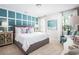Serene bedroom with decorative wall panels, neutral carpet, and lots of natural light at 437 Falling Leaf Loop, Myrtle Beach, SC 29588