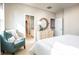 Comfortable main bedroom features a relaxing sitting area, en-suite bathroom, and access to the upstairs landing at 437 Falling Leaf Loop, Myrtle Beach, SC 29588