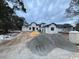 Newly constructed two-story home with a modern design, complemented by a spacious yard and blue sky at 4300 Gray Heron Dr., North Myrtle Beach, SC 29582