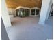 Covered outdoor patio with stone flooring and a wood plank ceiling, adding rustic charm to the modern design at 4300 Gray Heron Dr., North Myrtle Beach, SC 29582