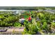 An aerial view of a serene neighborhood surrounded by lush greenery, offering a peaceful living environment at 4363 Bayshore Dr., Little River, SC 29566