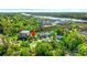 Aerial view of a charming neighborhood nestled among lush greenery and a scenic river, showcasing community and nature at 4363 Bayshore Dr., Little River, SC 29566
