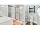 Well-lit bathroom featuring a glass-enclosed shower, modern fixtures, and a neutral color palette at 4363 Bayshore Dr., Little River, SC 29566