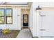 Inviting front entrance features modern black door with glass panel, adding curb appeal at 4363 Bayshore Dr., Little River, SC 29566