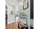 Bright hallway with wood floors leads to open living spaces; decorated with charming accents at 4363 Bayshore Dr., Little River, SC 29566