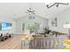 Open living room with a vaulted ceiling, comfortable sofa, and access to outdoor space at 4363 Bayshore Dr., Little River, SC 29566