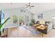 Bright living room featuring a comfortable couch, stylish rug, and sliding doors to the outside at 4363 Bayshore Dr., Little River, SC 29566