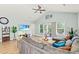 Cozy living area featuring a large sectional couch, vaulted ceiling, and sliding glass doors at 4363 Bayshore Dr., Little River, SC 29566