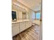 Bright bathroom features a double vanity, large mirror, and separate tub and shower at 4394 Daphne Ln. # F, Murrells Inlet, SC 29576