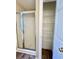 Bathroom features a shower, large closet with shelves, and neutral walls at 4394 Daphne Ln. # F, Murrells Inlet, SC 29576