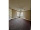 Neutral bedroom with ceiling fan, two windows letting in ample light and brown carpet at 4394 Daphne Ln. # F, Murrells Inlet, SC 29576