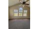 Bedroom featuring carpet floors, ceiling fan, and a large window at 4394 Daphne Ln. # F, Murrells Inlet, SC 29576
