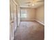 Cozy bedroom with neutral paint, carpet, ceiling fan, and a bright window overlooking the outdoors at 4394 Daphne Ln. # F, Murrells Inlet, SC 29576