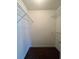 Walk-in closet featuring white walls, metal shelving, and brown carpet at 4394 Daphne Ln. # F, Murrells Inlet, SC 29576