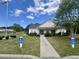 Exterior of community clubhouse with handicap parking and beautiful landscaping at 4394 Daphne Ln. # F, Murrells Inlet, SC 29576