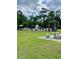 Community pool area with seating, surrounded by lush landscaping and trees at 4394 Daphne Ln. # F, Murrells Inlet, SC 29576
