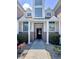 Close-up view of the townhome entrance, showing address, brick accents, and a glimpse into the interior at 4394 Daphne Ln. # F, Murrells Inlet, SC 29576