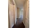 Neutral hallway features carpet flooring and access to various rooms through white doors at 4394 Daphne Ln. # F, Murrells Inlet, SC 29576