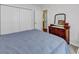 Cozy bedroom with plush carpeting, a comfortable bed, dresser, and ample closet space at 454 Sean River Rd., Conway, SC 29526