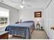 Cozy bedroom with plush carpeting, a comfortable bed, ceiling fan and a picturesque artwork at 454 Sean River Rd., Conway, SC 29526