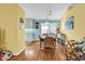 Cozy dining area with hardwood floors, view of the kitchen, and sliding glass doors to the backyard at 454 Sean River Rd., Conway, SC 29526
