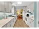 Bright kitchen open to dining area with white cabinets, stainless appliances and plenty of counter space at 454 Sean River Rd., Conway, SC 29526