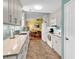 Bright kitchen open to dining area with white cabinets, stainless appliances and plenty of counter space at 454 Sean River Rd., Conway, SC 29526