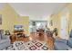 Bright and airy living room with hardwood floors and neutral walls connecting to the dining area at 454 Sean River Rd., Conway, SC 29526