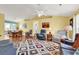 Spacious living room featuring a large rug, ceiling fan, and views into the dining area at 454 Sean River Rd., Conway, SC 29526