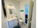 Bathroom with new vanity, toilet, and gray plank flooring at 4783 Wild Iris Dr. # 101, Myrtle Beach, SC 29577