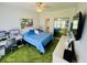 Cozy bedroom with a workspace, mirrored closet, and playful green carpet throughout the space at 4783 Wild Iris Dr. # 101, Myrtle Beach, SC 29577