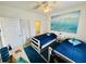 Nautical themed bedroom with two twin beds, coastal decor, and closet at 4783 Wild Iris Dr. # 101, Myrtle Beach, SC 29577