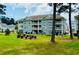 Well-maintained Condo with stone facade, private balconies and manicured lawns at 4783 Wild Iris Dr. # 101, Myrtle Beach, SC 29577